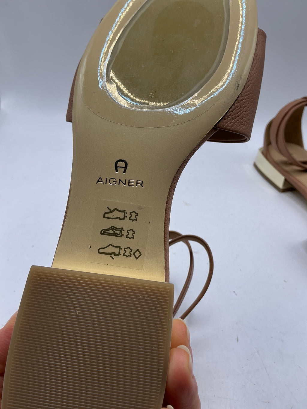 Aigner, low heeled leather sandals with ankle strap