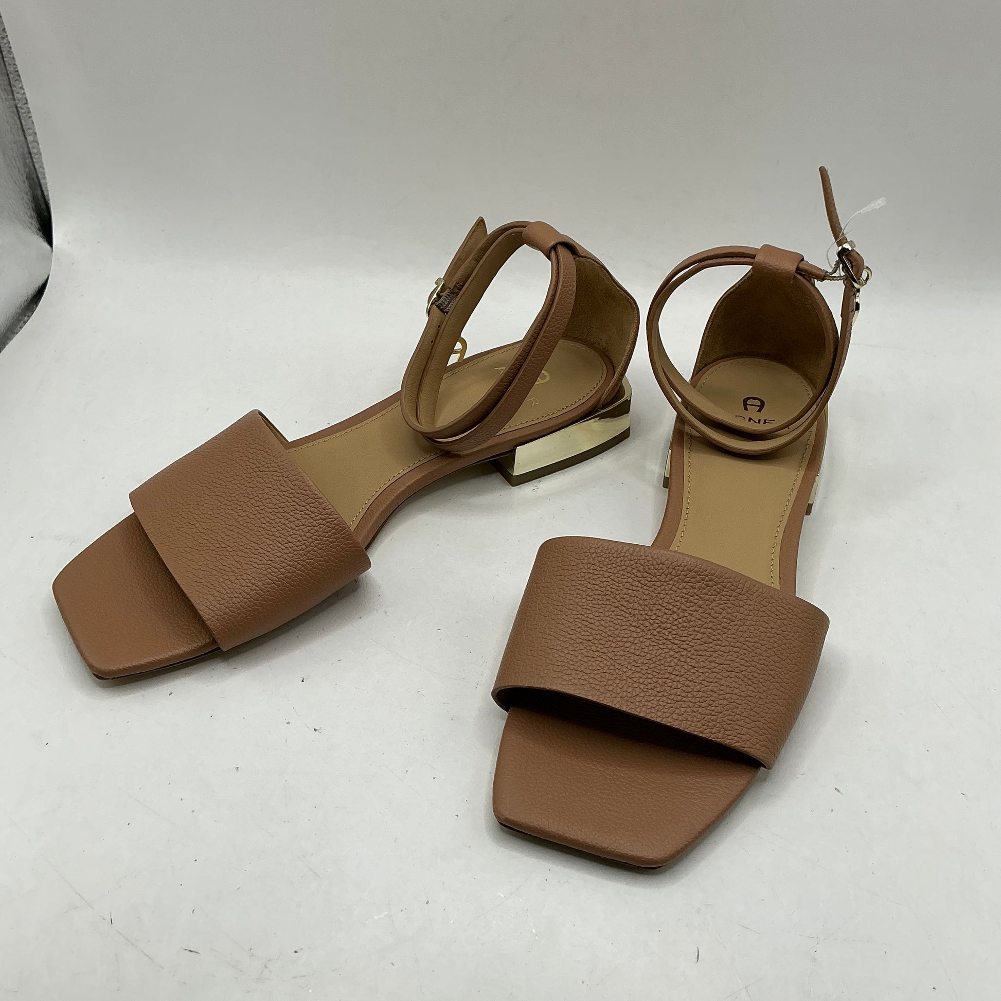 Aigner, low heeled leather sandals with ankle strap