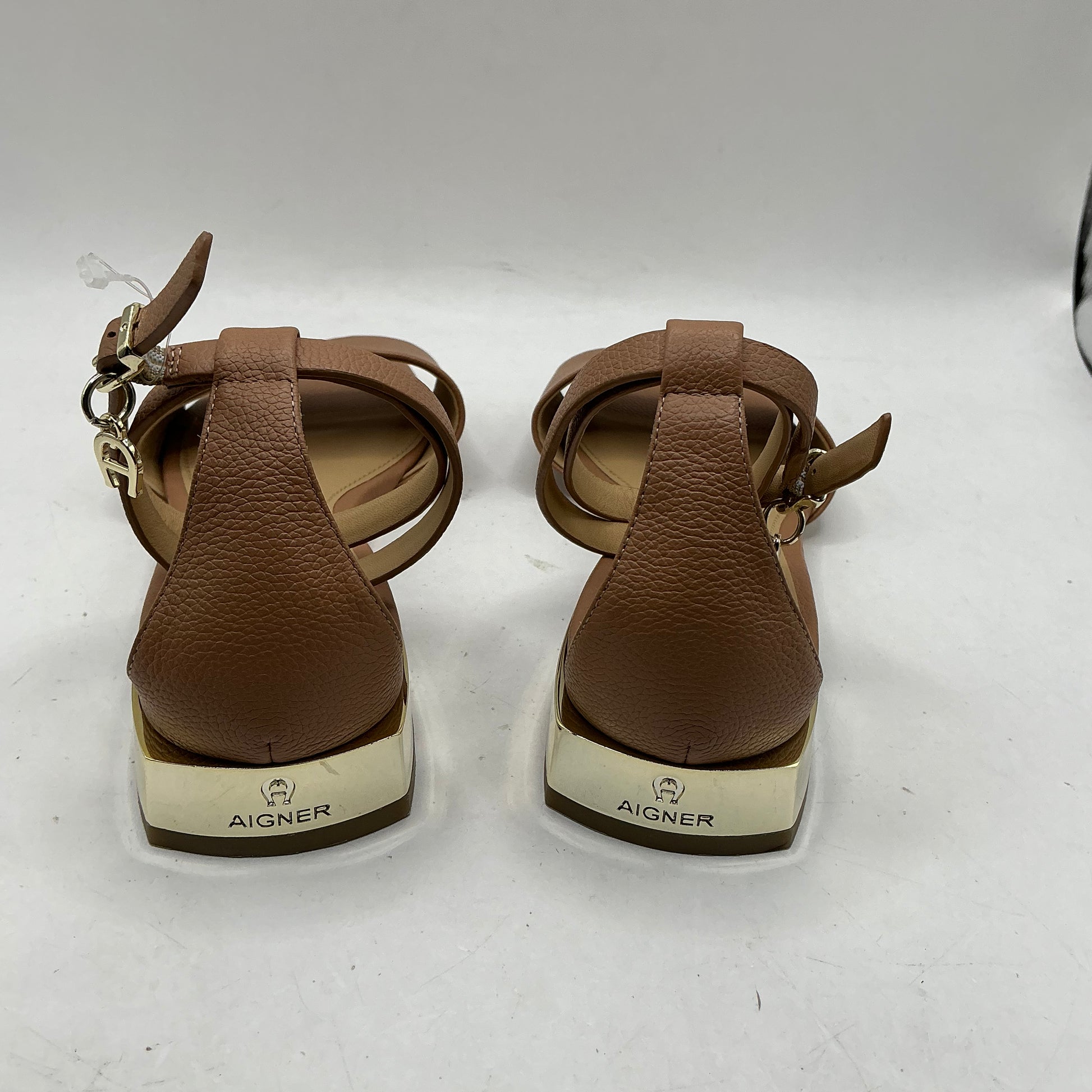 Aigner, low heeled leather sandals with ankle strap