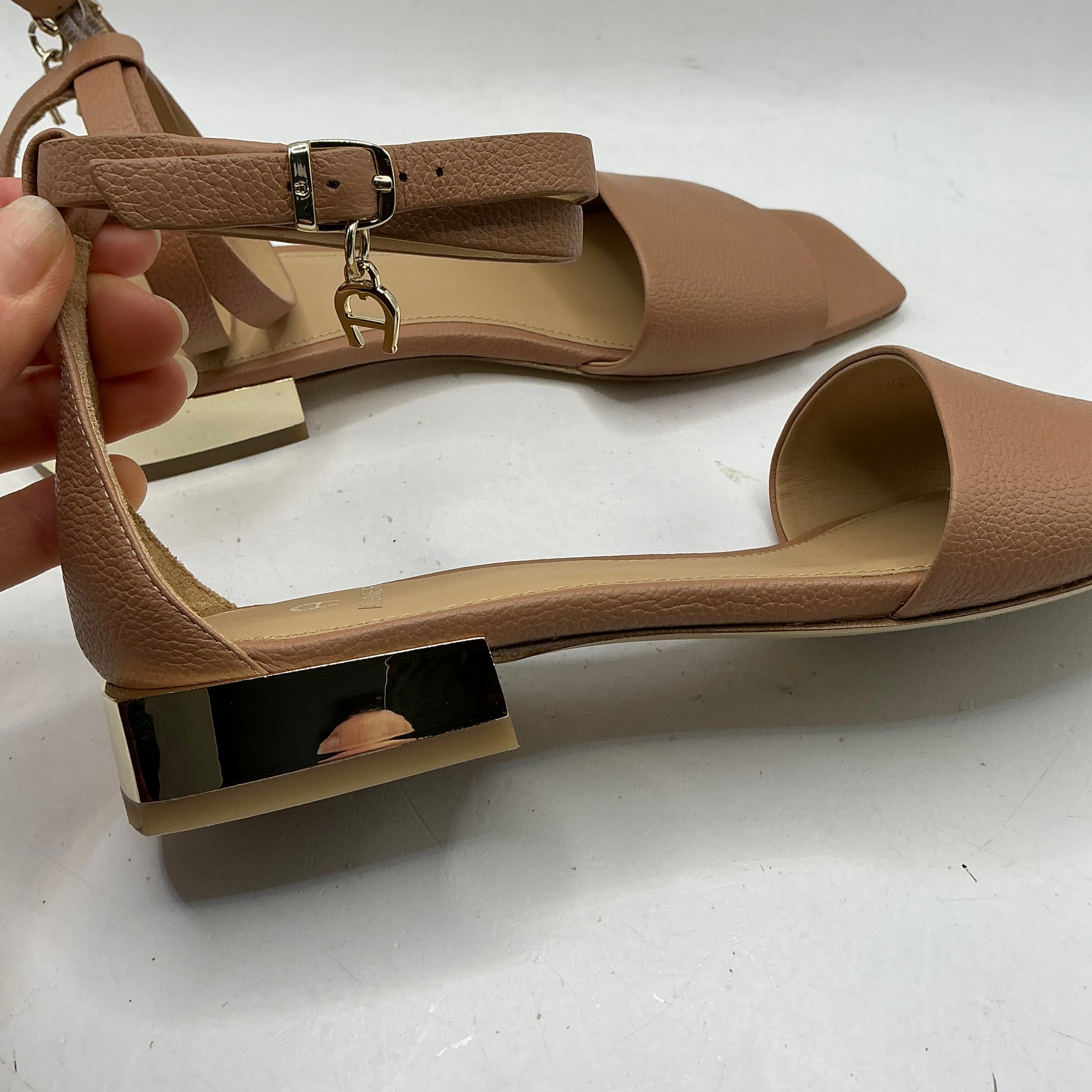 Aigner, low heeled leather sandals with ankle strap
