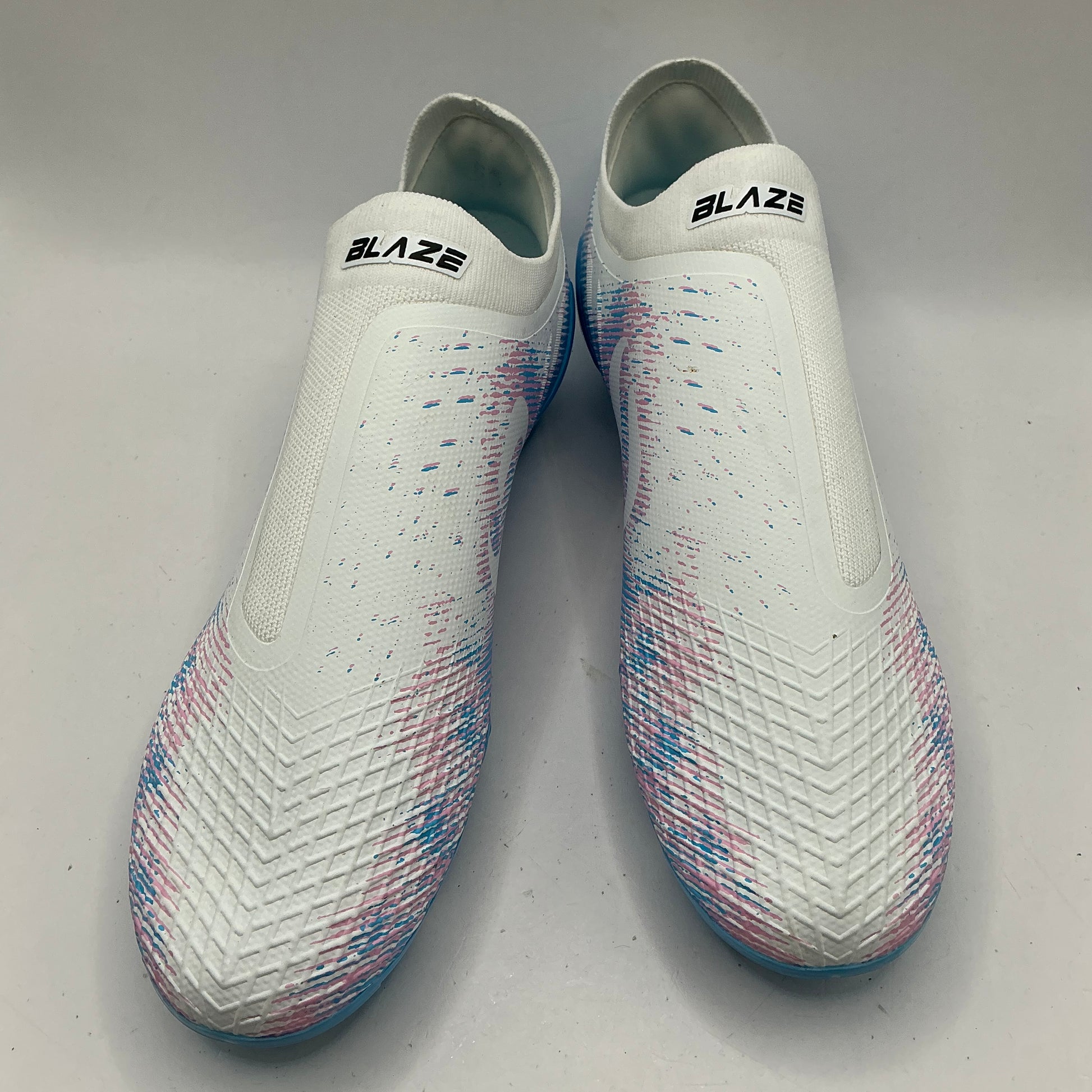 Sondico Laceless firm ground football boots, white, pink, blue